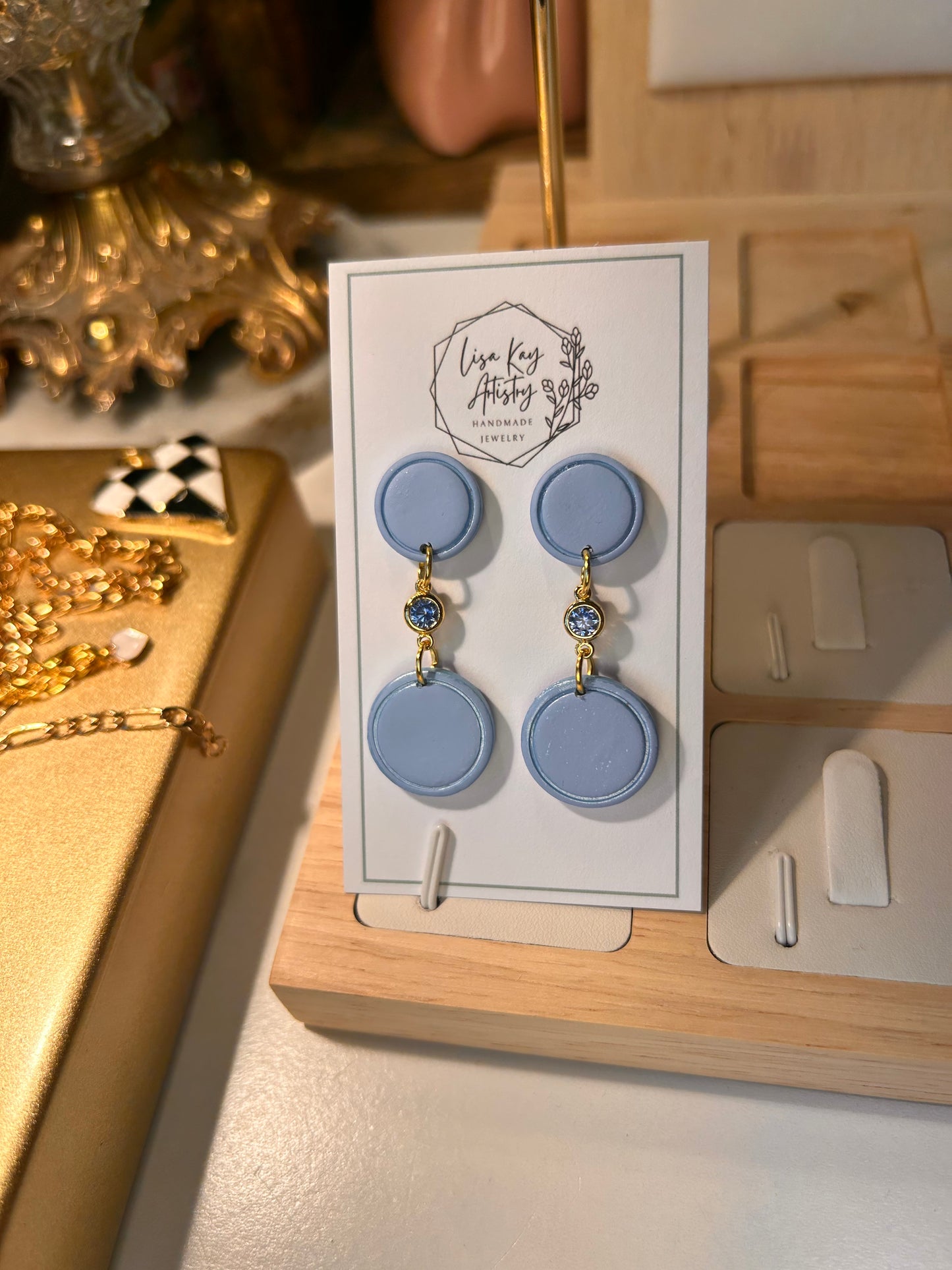 Small Blue Skies Round Dangles with light Blue Gem