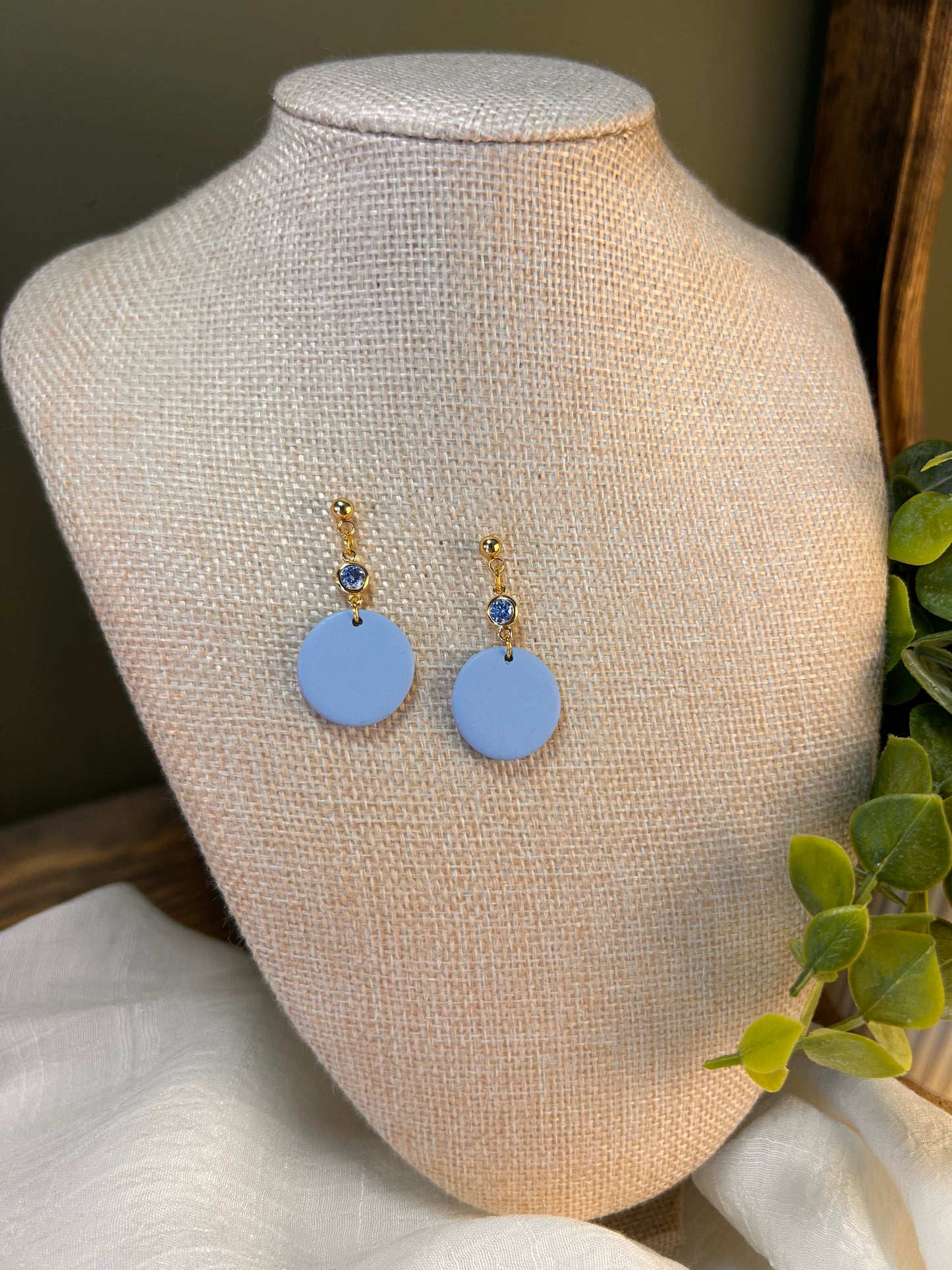 Blue Skies Round Dangles with light Blue Gem