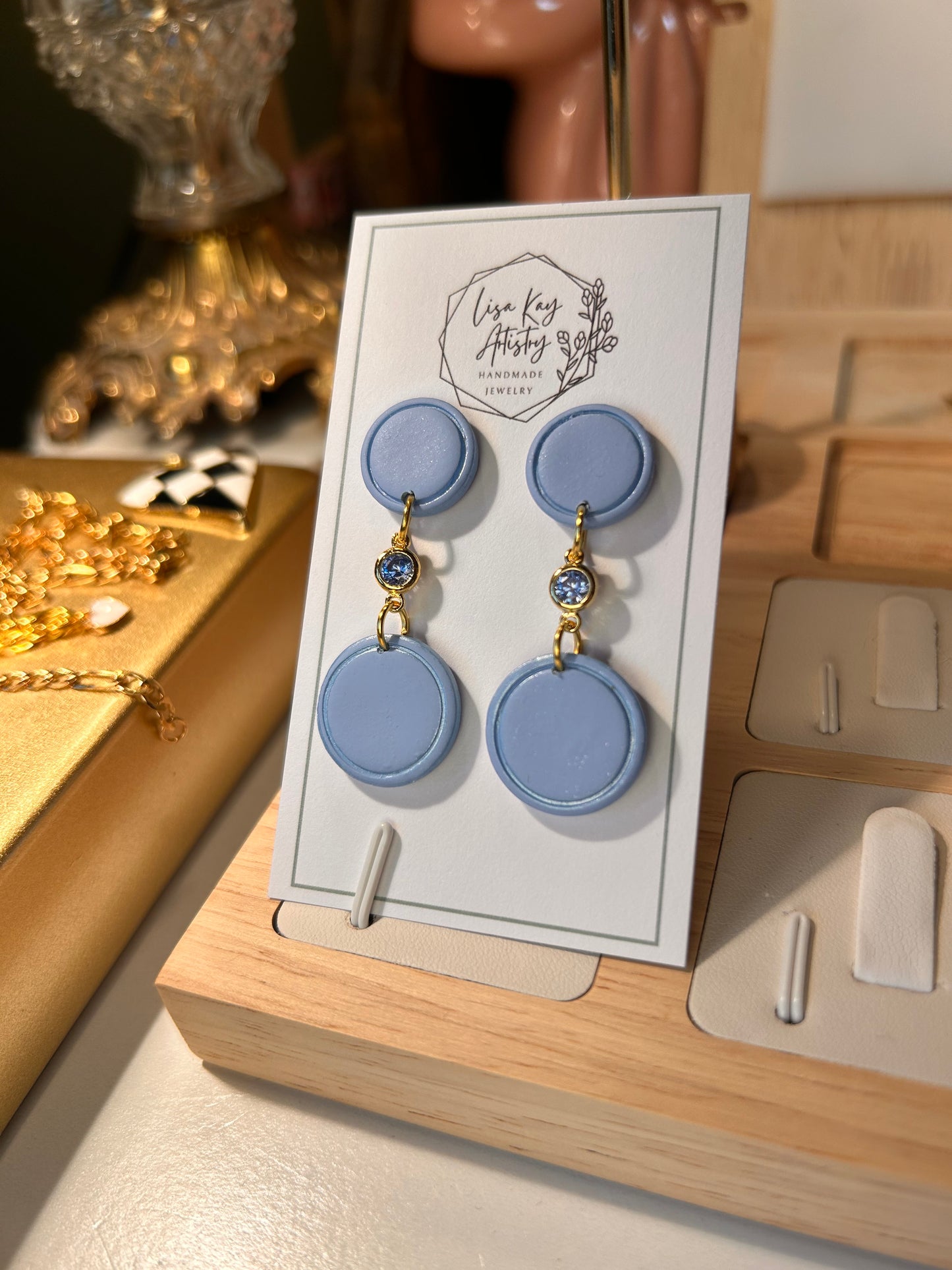 Small Blue Skies Round Dangles with light Blue Gem